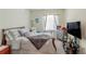 Cozy bedroom with a comfortable bed and plenty of storage space at 1756 Chatsworth Cir, St Cloud, FL 34771