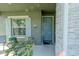 Charming front door entrance with stylish shutters and landscaping at 1756 Chatsworth Cir, St Cloud, FL 34771