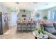 Modern kitchen with gray cabinets, island, and stainless steel appliances at 1756 Chatsworth Cir, St Cloud, FL 34771