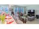 Spacious living room with gray sectional sofa and large TV at 1756 Chatsworth Cir, St Cloud, FL 34771