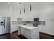 Contemporary kitchen with stainless steel appliances, a large island, and ample white cabinetry at 1806 Mondrian Cir, Winter Park, FL 32789