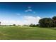 Expansive view of the lush green golf course, a golfer's paradise with scenic views at 1809 Wedgewood Way, Kissimmee, FL 34746
