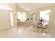 Bright, neutral living room with arched windows, high ceilings, tile floors, and comfortable seating at 1809 Wedgewood Way, Kissimmee, FL 34746