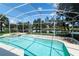 Screened in pool and spa overlooking a serene pond, perfect for relaxing and entertaining at 1809 Wedgewood Way, Kissimmee, FL 34746
