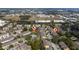 Aerial view of community showing pool, lush landscaping, and neighborhood streets at 2011 Stockton Dr, Sanford, FL 32771