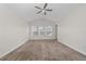 Spacious bedroom with three windows and a ceiling fan at 2011 Stockton Dr, Sanford, FL 32771