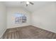 Bedroom with neutral carpet and a ceiling fan at 2011 Stockton Dr, Sanford, FL 32771