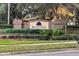 Regency Oaks community sign set in a brick structure with flowers and greenery at 2011 Stockton Dr, Sanford, FL 32771