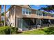 Back exterior view of home featuring a screened-in porch at 2011 Stockton Dr, Sanford, FL 32771