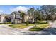 Corner lot townhome with attached garages, a sidewalk, and a street view at 2011 Stockton Dr, Sanford, FL 32771