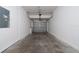 Attached garage with concrete flooring and a secure garage door at 2011 Stockton Dr, Sanford, FL 32771