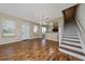 Open living room with wood floors and staircase at 2011 Stockton Dr, Sanford, FL 32771