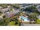 Aerial view of a community pool surrounded by palm trees and well-maintained landscaping at 2011 Stockton Dr, Sanford, FL 32771