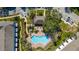Aerial view of swimming pool, palm trees, lounge chairs, and community gathering space at 2011 Stockton Dr, Sanford, FL 32771