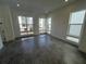 Bright and spacious room with large windows and gray tile floors at 2118 Whitney Marsh Aly, Orlando, FL 32804