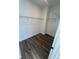 Spacious walk-in closet with wire shelving and wood-look flooring at 2118 Whitney Marsh Aly, Orlando, FL 32804