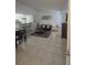 Open living area with tile floors and modern furniture at 2217 Grand Cayman Ct # 1234, Kissimmee, FL 34741