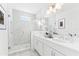 Luxurious bathroom with double vanity, marble finishes, and a glass-enclosed shower at 2221 Valentine Aly, Orlando, FL 32804