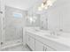 Elegant bathroom with double vanity, marble shower, and modern fixtures at 2221 Valentine Aly, Orlando, FL 32804