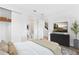 Bedroom with attached bath, large-screen TV, and closet for ample storage at 2221 Valentine Aly, Orlando, FL 32804