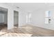 Spacious bedroom with hardwood floors, large windows, and walk-in closet at 2221 Valentine Aly, Orlando, FL 32804