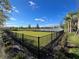 Fenced dog park with grassy area and lake views at 2221 Valentine Aly, Orlando, FL 32804