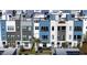 View of new Toll Brothers townhomes with modern architecture and a community neighborhood street at 2221 Valentine Aly, Orlando, FL 32804