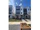 Modern townhouses with gray and white exterior, landscaping, and walkway at 2221 Valentine Aly, Orlando, FL 32804