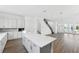 Modern kitchen with white cabinets, large island, and stainless steel appliances at 2221 Valentine Aly, Orlando, FL 32804