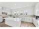 The bright and airy kitchen is complete with quartz countertops, stainless appliances, and ample cabinet space at 2221 Valentine Aly, Orlando, FL 32804