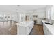 Modern kitchen with white cabinets, island, stainless steel appliances, and open layout at 2221 Valentine Aly, Orlando, FL 32804