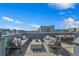 Spacious rooftop deck with lounge seating and dining, offering panoramic views and great for entertaining at 2221 Valentine Aly, Orlando, FL 32804