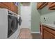 Well-equipped laundry room includes modern washer and dryer at 2350 Bradbury Rd, Haines City, FL 33844