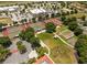 Aerial view of community amenities featuring tennis courts, basketball court, and landscaping at 2351 Fenton Ave, Clermont, FL 34711