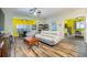 Bright living room featuring a modern white couch, tile floors, and decorative ceiling fan at 2351 Fenton Ave, Clermont, FL 34711