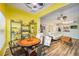 Open floor plan showcases the living and dining areas, featuring tile floors and abundant light at 2351 Fenton Ave, Clermont, FL 34711