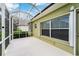 Enclosed patio area with a screen, offering an outdoor living space with privacy at 2351 Fenton Ave, Clermont, FL 34711