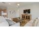Bright living room with white shiplap wall, comfy sofas, and a rustic coffee table at 2705 Serenity Meadow Dr, Kissimmee, FL 34744