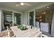 Relaxing patio with wooden dining table and chairs, offering access to the backyard at 2705 Serenity Meadow Dr, Kissimmee, FL 34744