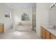 Well-lit bathroom with a tiled floor, garden tub, shower and dual vanity at 293 Saxony Ct, Winter Springs, FL 32708