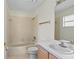 Standard bathroom with a tub and shower, single sink vanity with mirror at 293 Saxony Ct, Winter Springs, FL 32708