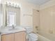 Standard bathroom with a tub and shower, single sink vanity with good lighting at 293 Saxony Ct, Winter Springs, FL 32708