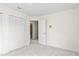 Bedroom featuring neutral carpet, light walls, two closets, and an ensuite bathroom at 293 Saxony Ct, Winter Springs, FL 32708