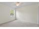 Neutral bedroom with a ceiling fan, window overlooking a backyard at 293 Saxony Ct, Winter Springs, FL 32708