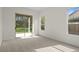 Bright bedroom featuring sliding glass door access to a patio, and large windows allowing lots of natural light at 293 Saxony Ct, Winter Springs, FL 32708