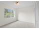 Bedroom featuring neutral carpet, light walls, a window, and a large closet at 293 Saxony Ct, Winter Springs, FL 32708
