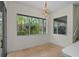 Bright dining area with large windows that offers tranquil views of lush landscaping at 293 Saxony Ct, Winter Springs, FL 32708