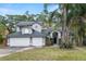 Charming two-story home with a three car garage and well-maintained landscaped yard at 293 Saxony Ct, Winter Springs, FL 32708