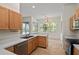 Eat-in kitchen with stainless steel appliances, laminate countertops, and sliding doors at 293 Saxony Ct, Winter Springs, FL 32708