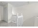 Stairwell with white railings and carpeted steps at 293 Saxony Ct, Winter Springs, FL 32708